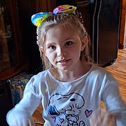 Kara joined the competition — help win amazing prizes! appliance, cabinet, cartoon, casual_clothing, child, colorful_bow, curious, face, girl, home, indoor, kitchen, long_hair, motion_blur, person, playful, snoopy, sweatshirt, wood_floor, young