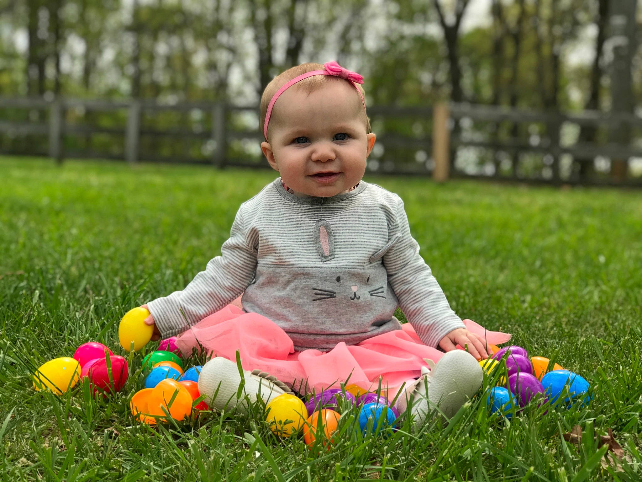 Julianne is registered to the contest to win money with this photo: baby, baby_playing_with_toys, child, easter, easter_egg, fun, grass, happy, holiday, joy, lawn, meadow, people_in_nature, person, photography, plant, play, playing_with_kids, sitting, smile