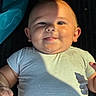 Kohen joined the competition — help win amazing prizes! baby, infant, face, smile, tongue, onesie, striped_clothing, chubby_cheeks, hand, skin, blue_fabric, shadow, closeup, lying_down, cute, sunlight, warm_light, portrait, happy, child