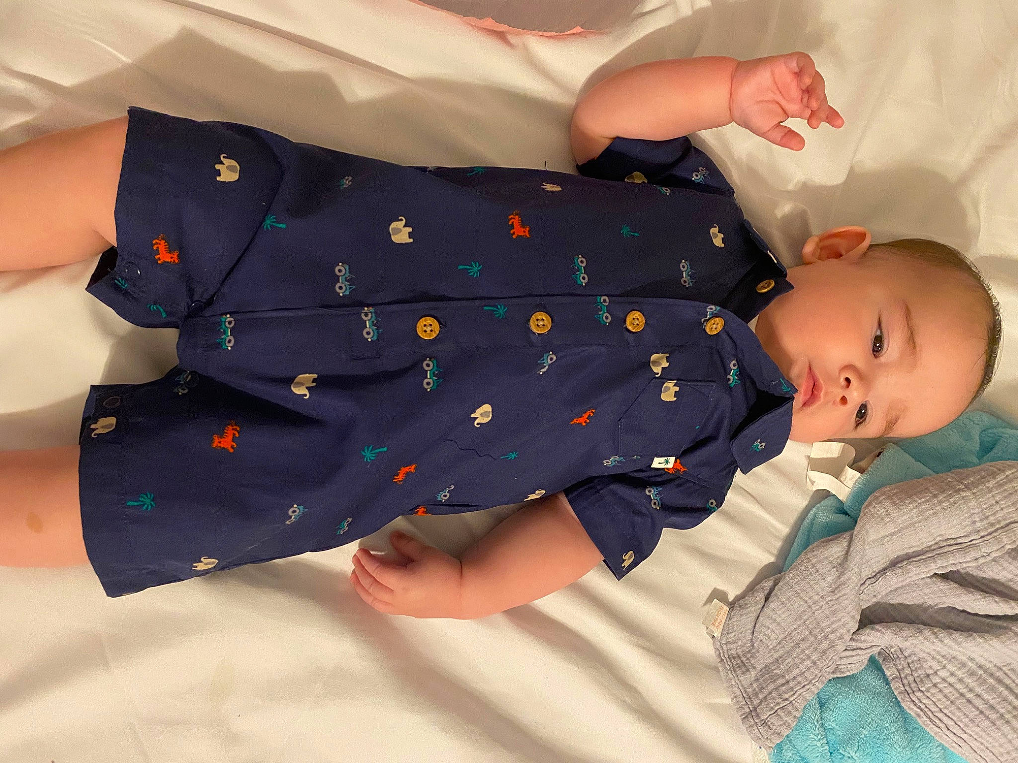 Harry is registered to the contest to win money with this photo: baby, baby_products, baby_sleeping, baby_toddler_clothing, child, comfort, electric_blue, gesture, happy, human_body, human_leg, infant_bodysuit, linens, pattern, person, polka_dot, sitting, sleep, sleeve, sock