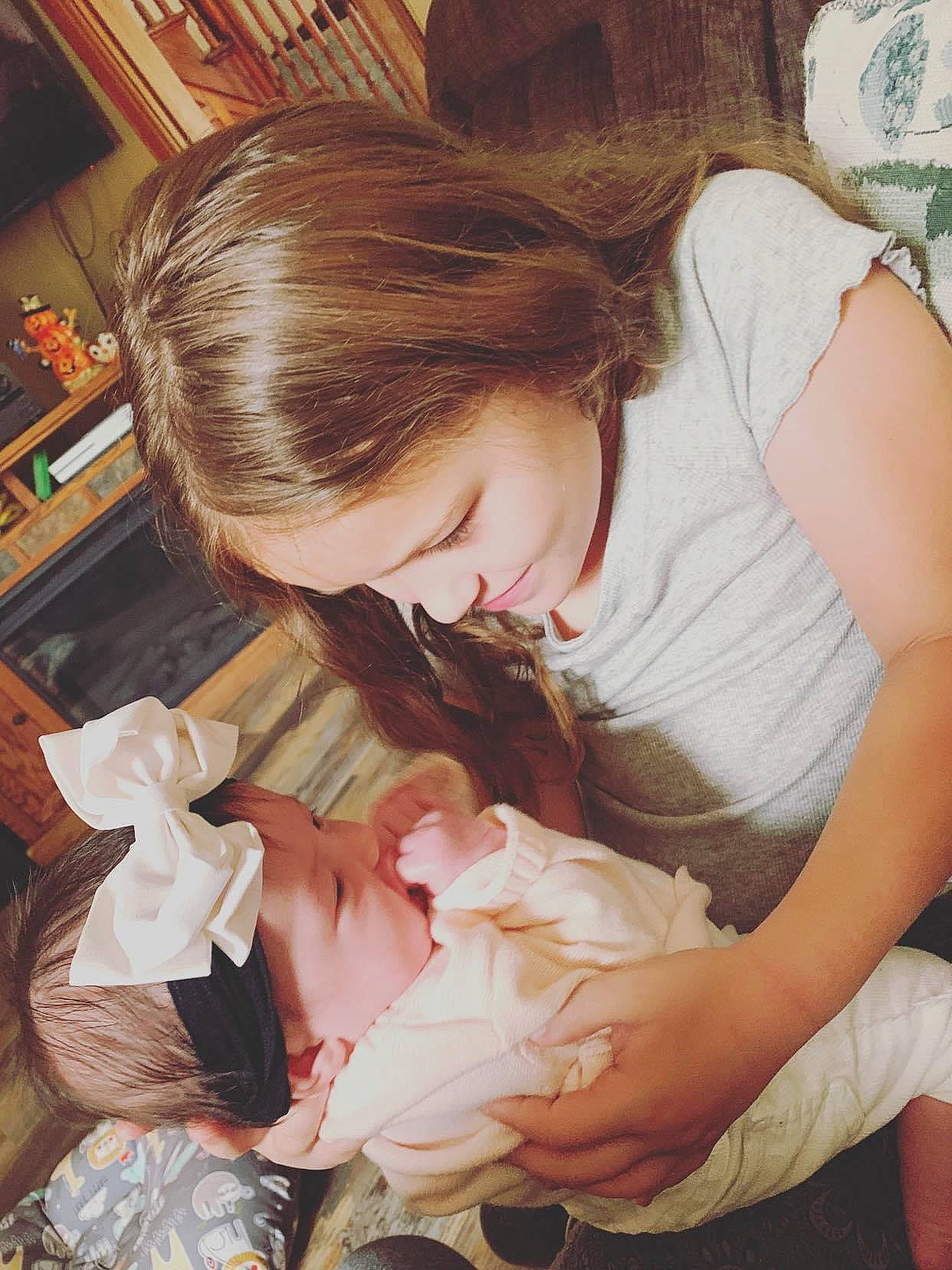 Cordelia is registered to the contest to win money with this photo: child, person