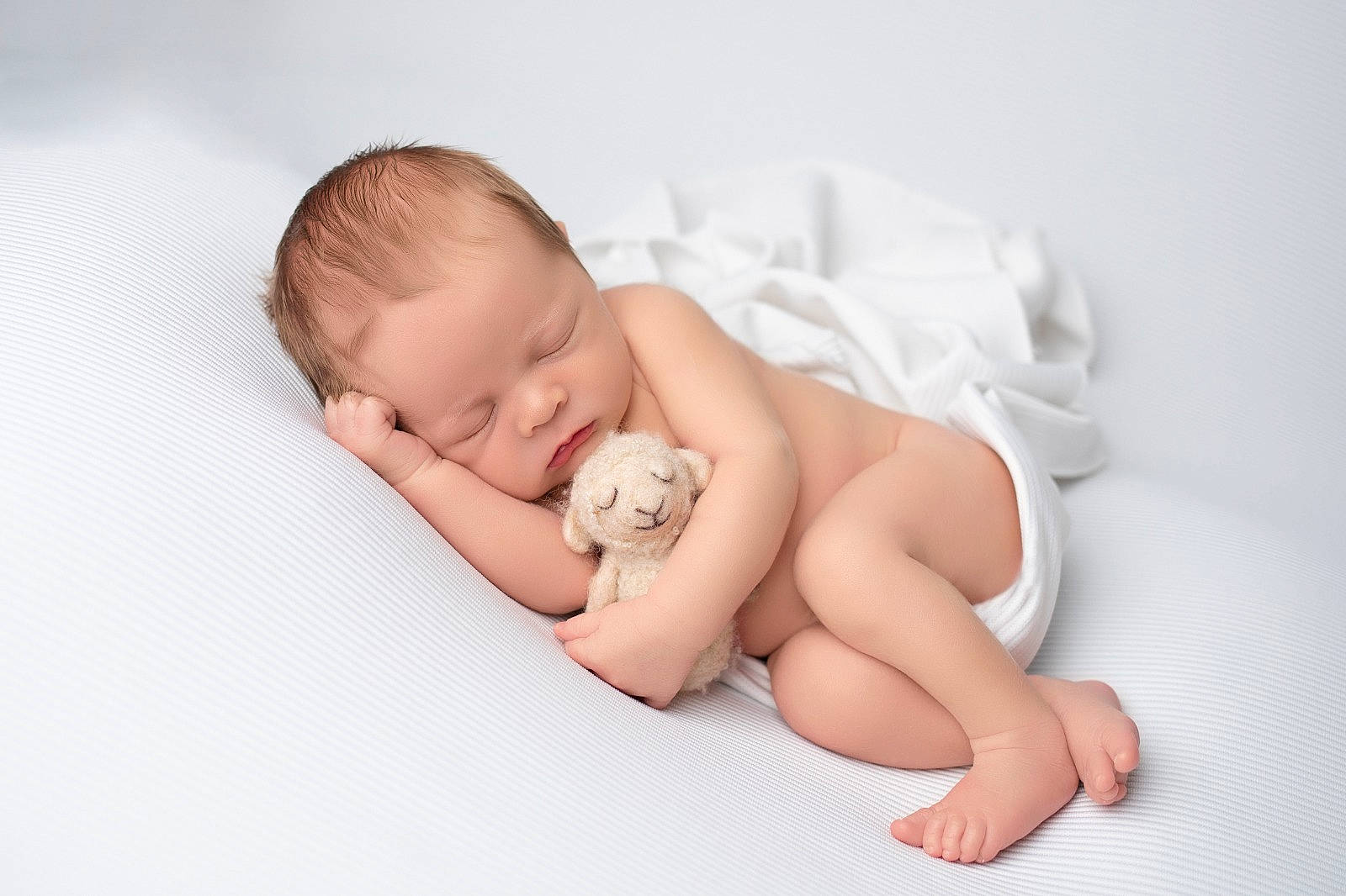 Loki is registered to the contest to win money with this photo: baby, baby_sleeping, baby_toddler_clothing, barefoot, cheek, child, comfort, finger, flash_photography, foot, happy, human_leg, linens, nail, pattern, person, portrait_photography, sitting, skin, stomach