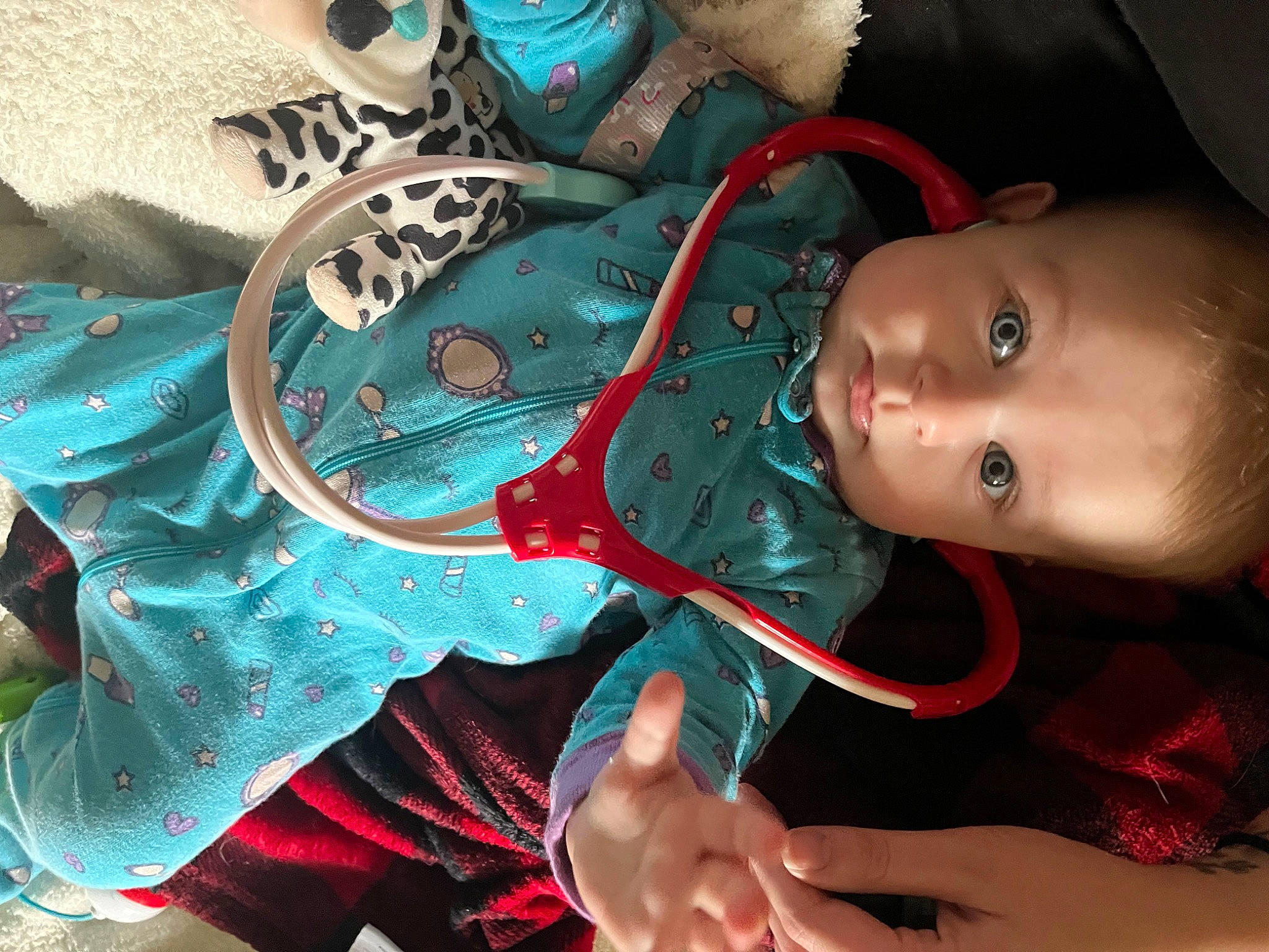 Winter is registered to the contest to win money with this photo: baby, baby_products, blue, child, costume, electric_blue, fashion_accessory, fictional_character, fun, green, hand, mouth, nail, pattern, person, pink, skin, smile, textile, toddler