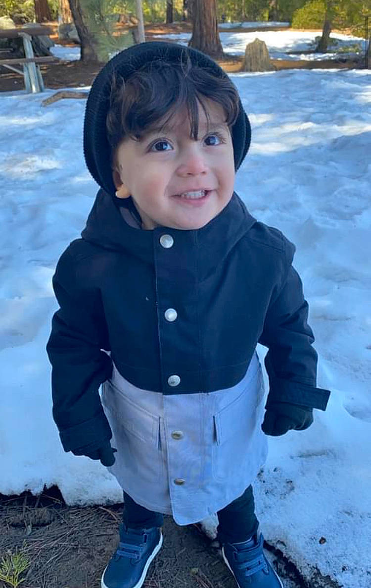 Enzo joined the competition — help win amazing prizes! baby_toddler_clothing, boot, cheek, child, cool, electric_blue, freezing, fun, grass, happy, jacket, outerwear, person, plant, sleeve, smile, snow, standing, toddler, tree