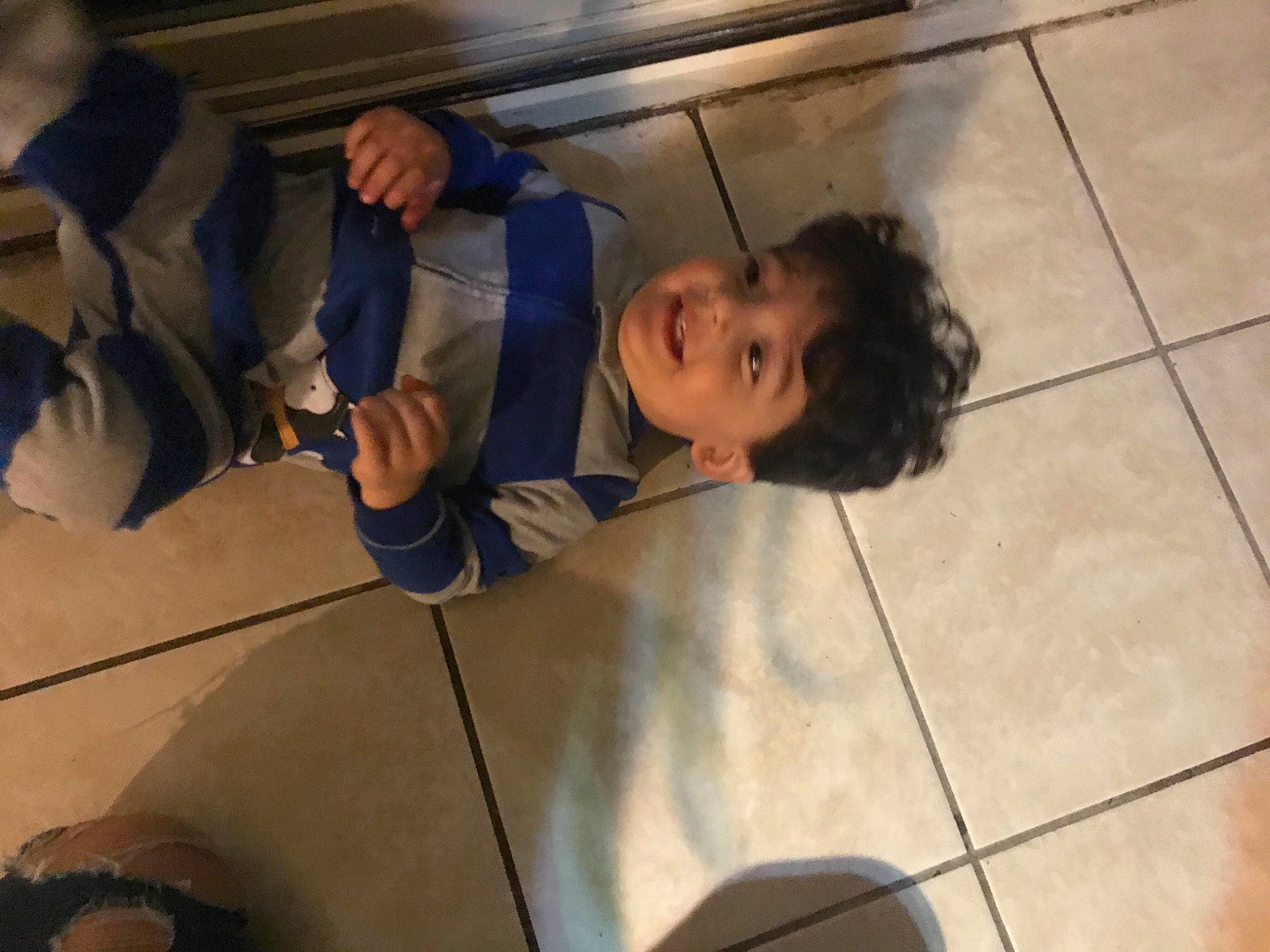 Enzo joined the competition — help win amazing prizes! auto_part, child, flooring, fun, hand, jacket, landscape, leisure, person, recreation, room, shadow, sitting, toddler, wood