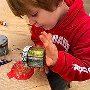 David participe au concours pour gagner de l'argent avec cette photo : bodypart, boy, can, child, clothing, cream, eating, face, finger, food, footwear, hand, head, male, paintcontainer, person, photography, portrait, shoe, tin
