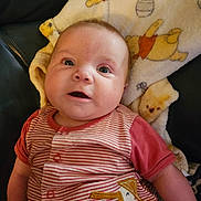 Phoenix joined the competition — help win amazing prizes! baby, infant, face, eyes, mouth, striped_shirt, pelican_patch, blanket, winnie_the_pooh, soft_toy, cozy, cute, child, portrait, indoors, expression, clothing, lying_down, person, young_child