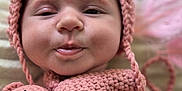 Maïlya a rejoint le concours — aidez-le/la à gagner de superbes lots ! baby, infant, face, crocheted_hat, crocheted_toy, pink, soft_texture, close_up, cute, child, portrait, handmade, knitted, adorable, smiling, indoors, young_child, headwear, plush_toy, newborn