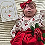 baby, sleeping, red_bow, headband, red_skirt, white_top, heart_pattern, rose, flower, card, milestone, one_month, blanket, cute, infant, portrait, soft_texture, peaceful, lying_down, celebration