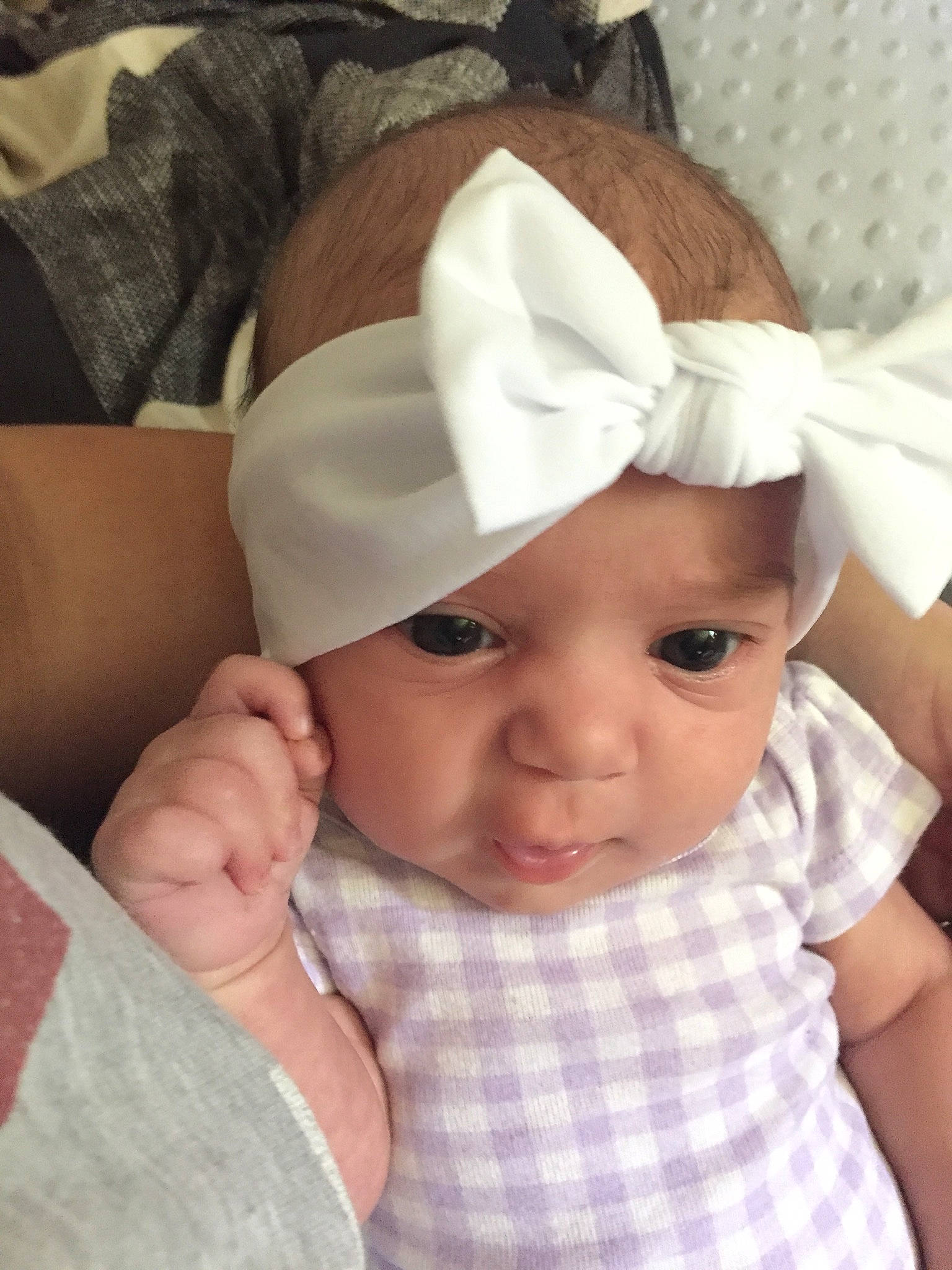 Kora is registered to the contest to win money with this photo: baby, baby_products, baby_toddler_clothing, cap, cheek, child, chin, comfort, eyelash, face, fashion_accessory, gesture, happy, hat, headgear, headwear, pattern, person, skin, sleeve