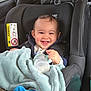 Tommy a rejoint le concours — aidez-le/la à gagner de superbes lots ! baby, car_seat, blanket, bottle, smiling, infant, child, clothing, mirror, car_interior, seatbelt, blue_sock, happy, cute, milk, jacket, head, face, baby_toy, indoors