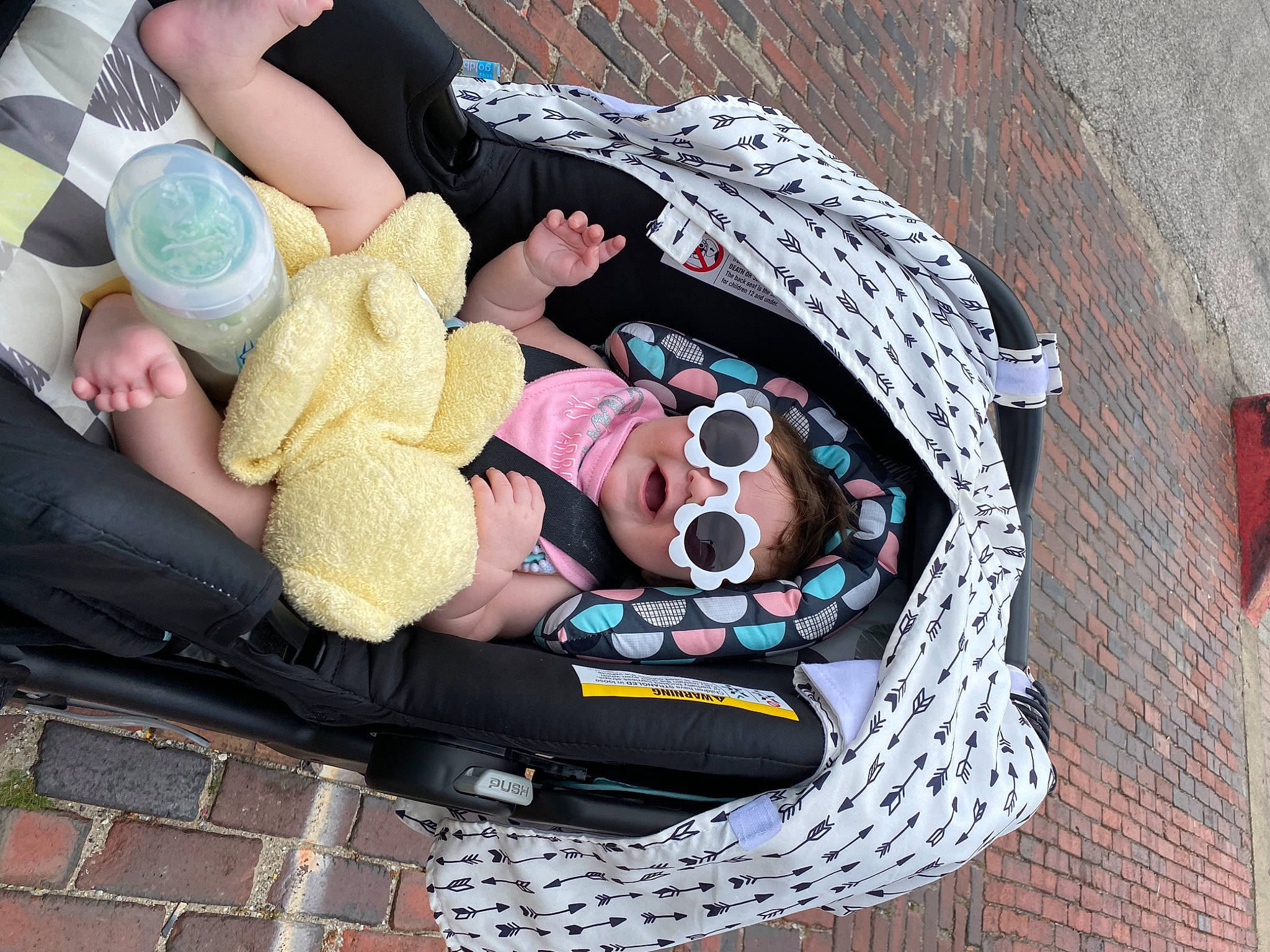 Elizabeth joined the competition — help win amazing prizes! baby_products, bag, comfort, doll, eyewear, fashion_accessory, flooring, foot, fun, human_leg, leisure, linens, luggage_and_bags, pattern, person, sidewalk, sitting, stuffed_toy, sunglasses, thigh