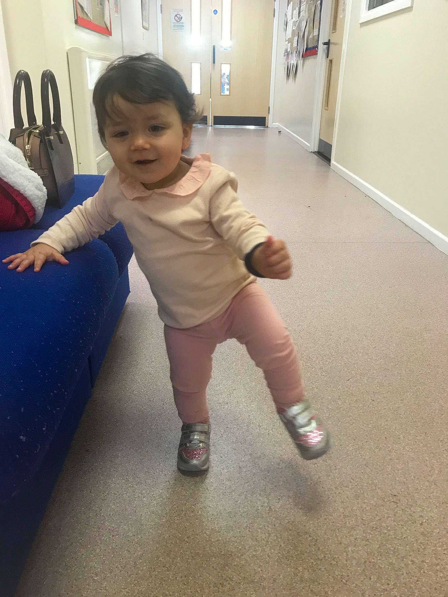 Zarah is registered to the contest to win money with this photo: baby, child, floor, flooring, joint, knee, leg, person, shoe, shoulder, skin, standing, toddler