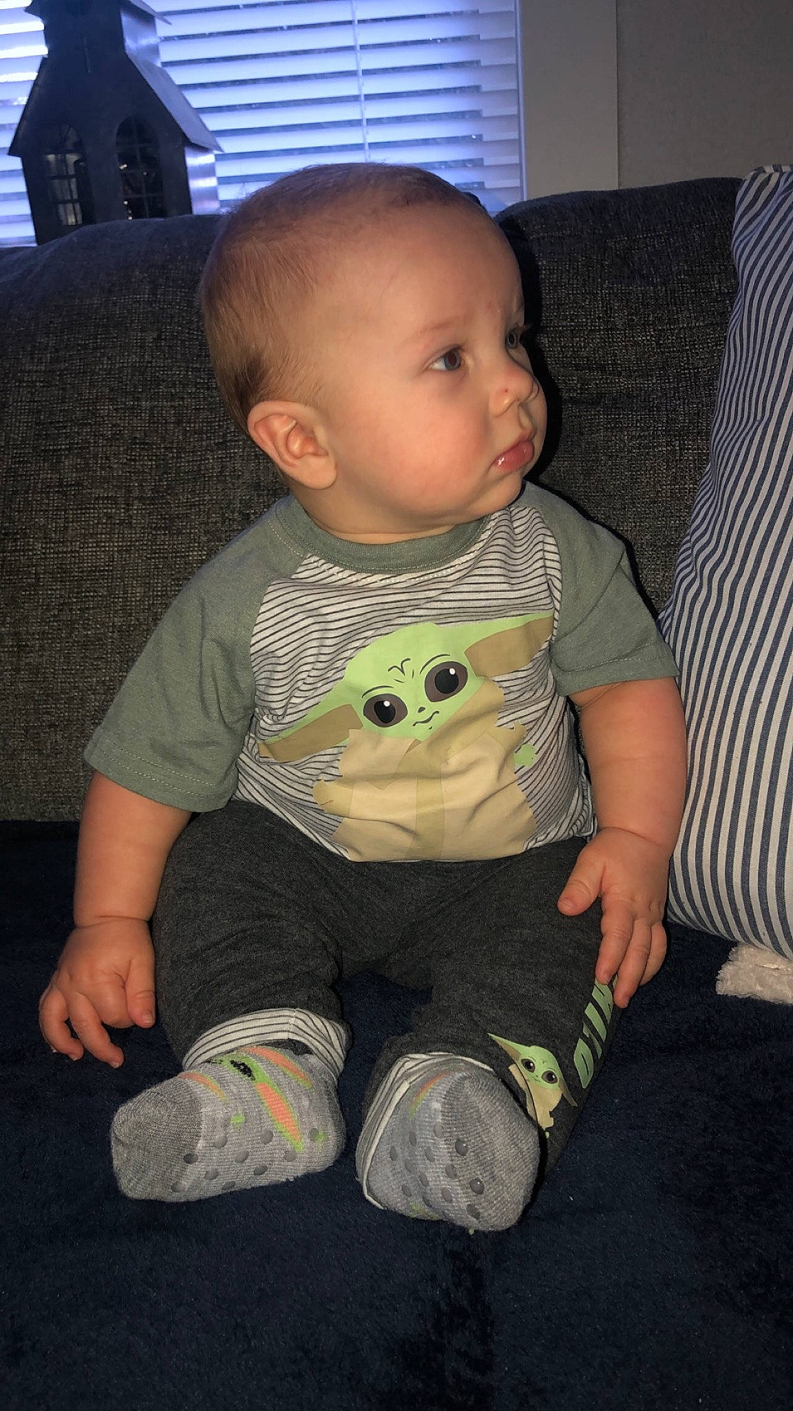 Clayson is registered to the contest to win money with this photo: baby, baby_toddler_clothing, cheek, child, comfort, couch, eye, finger, floor, flooring, foot, fun, knee, person, sitting, skin, sleeve, standing, t_shirt, toddler