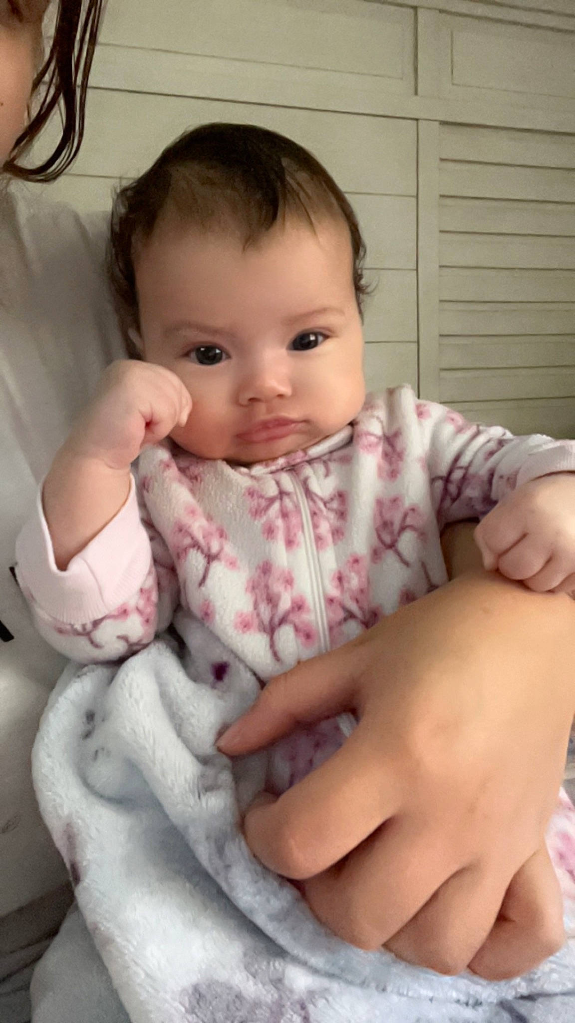 Milani is registered to the contest to win money with this photo: arm, baby, baby_toddler_clothing, cheek, chin, eyebrow, eyelash, facial_expression, finger, gesture, hand, human_body, lip, mammal, mouth, neck, nose, person, product, skin