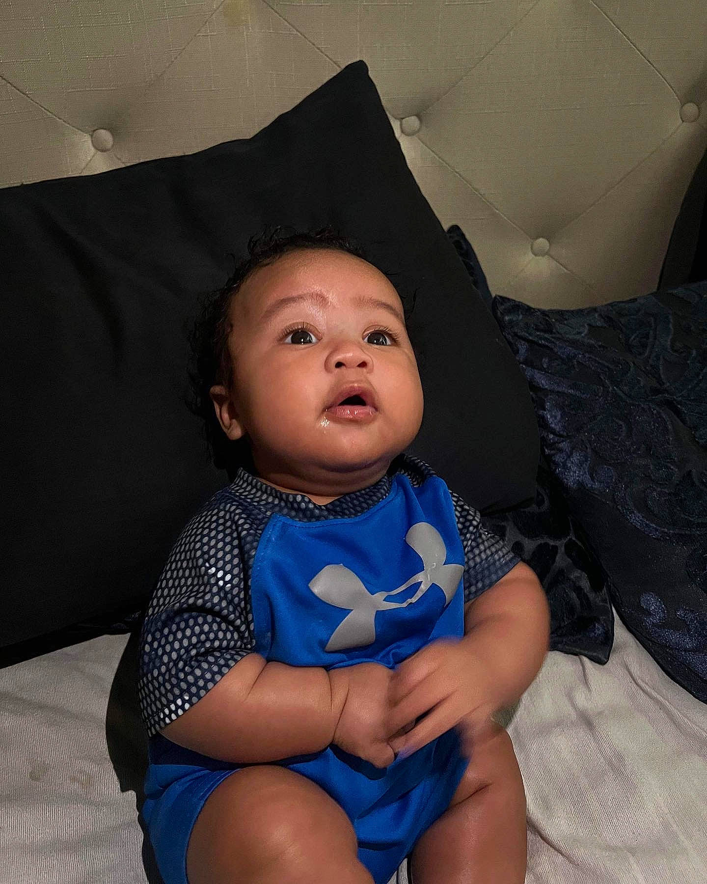 Mak is registered to the contest to win money with this photo: baby, baby_toddler_clothing, cheek, chin, comfort, cool, electric_blue, eye, face, finger, flash_photography, fun, hairstyle, head, iris, joint, mouth, person, skin, thigh