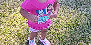 Ashanti is registered to the contest to win money with this photo: child, clothing, face, female, footwear, girl, grass, head, lawn, nature, outdoors, park, person, photography, plant, portrait, shoe, shorts, t_shirt, yard