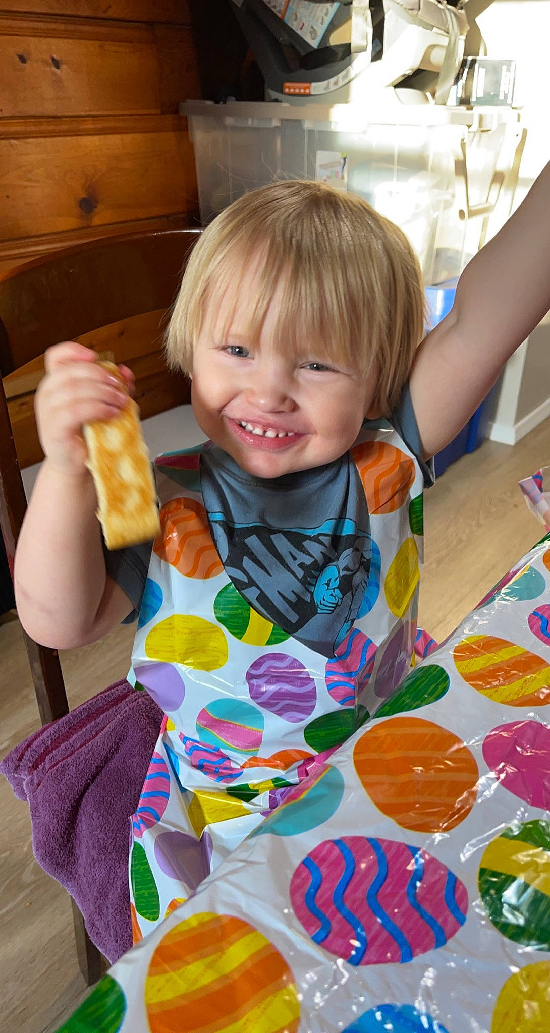 Liam is registered to the contest to win money with this photo: arm, baby, baby_toddler_clothing, chair, child, dress, event, facial_expression, fun, hand, happy, human, joy, pattern, person, play, sitting, smile, summer, tableware