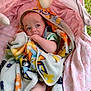 Kendrie joined the competition — help win amazing prizes! baby, blanket, child, colorful, cute, face, fingers, grass, hand, infant, outdoor, patterned_blanket, pink_fabric, portrait, resting, soft, sucking_thumb, toddler, wrapped, young_child