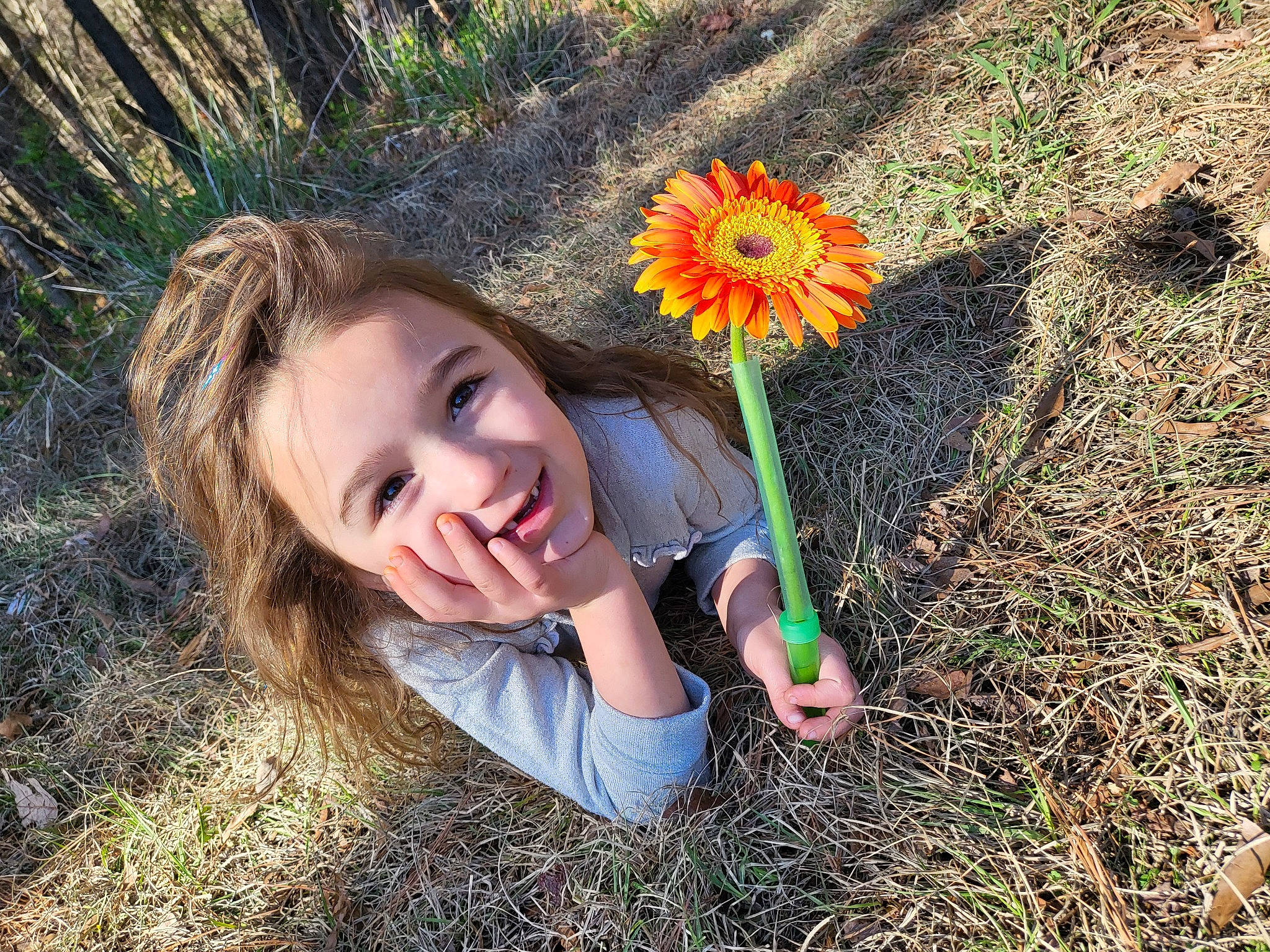 Cassie Flo is registered to the contest to win money with this photo: blond, eye, face, field, flash_photography, flower, grass, grass_family, grassland, happy, iris, landscape, leaf, meadow, people_in_nature, person, petal, plant, prairie, vegetation