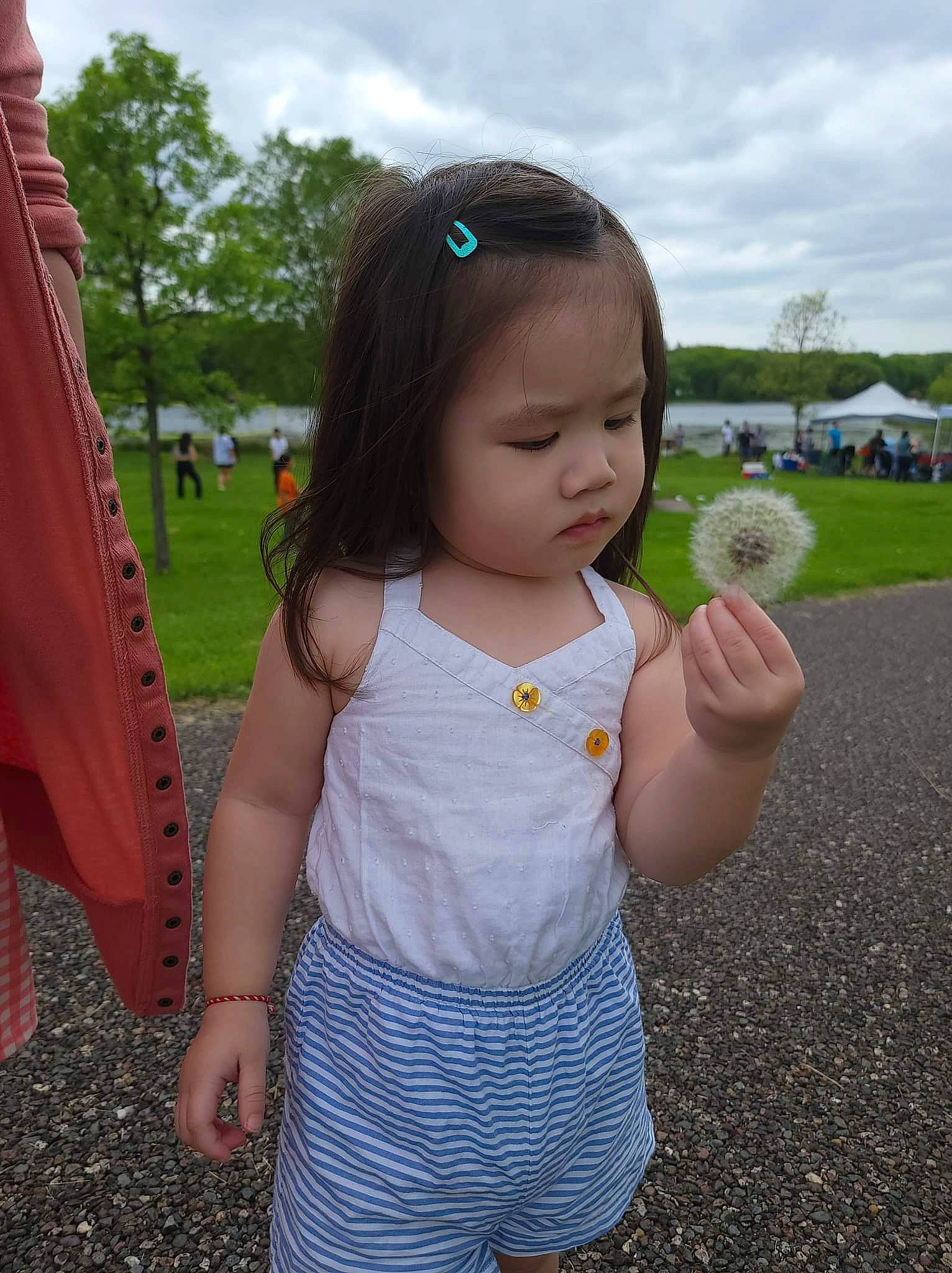 Pearl is registered to the contest to win money with this photo: baby_toddler_clothing, cloud, eye, facial_expression, fun, grass, hand, happy, human_body, nose, person, pink, plant, skin, sky, sleeve, standing, summer, sunglasses, toddler