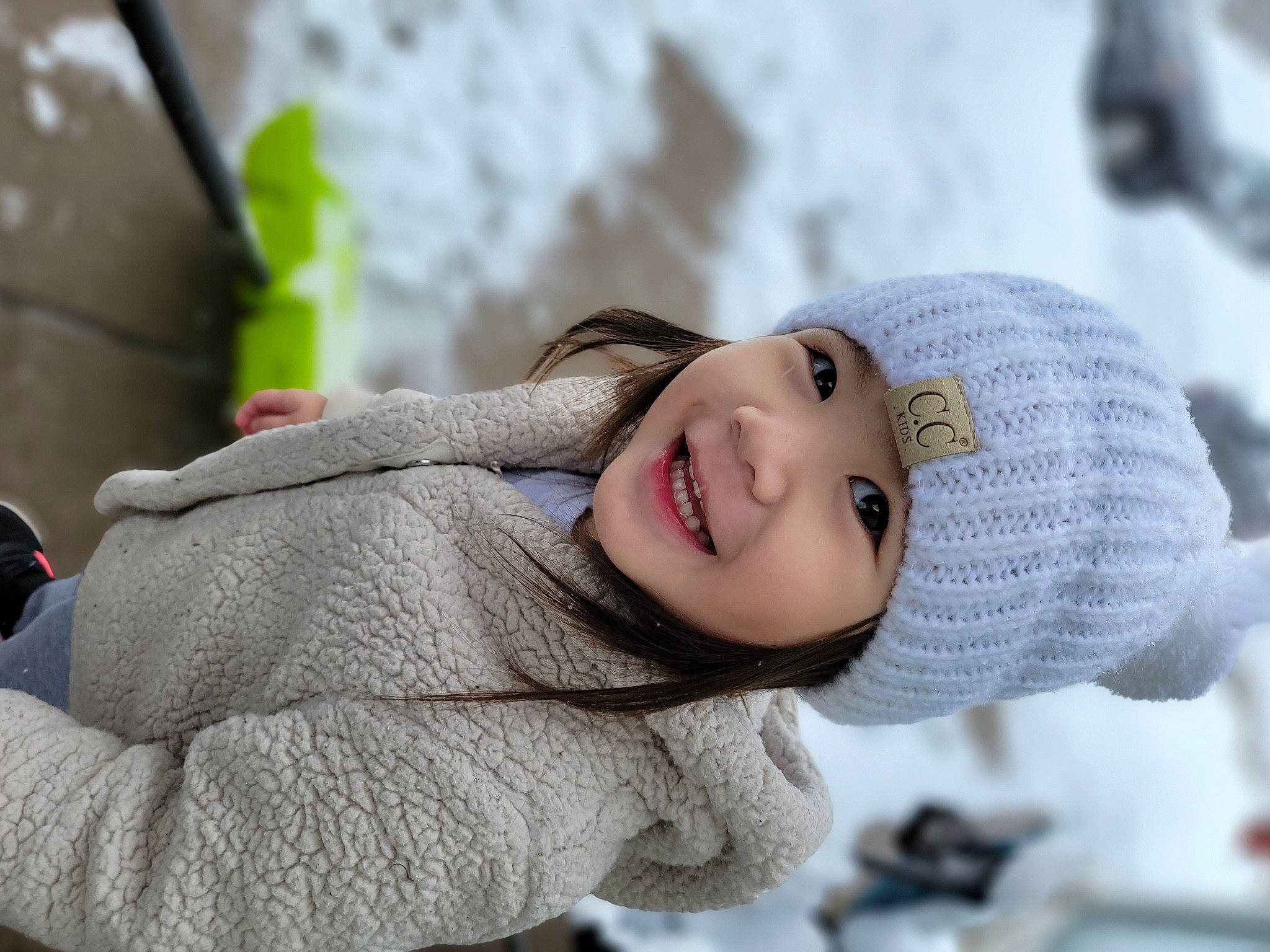 Pearl is registered to the contest to win money with this photo: cap, child, eye, fashion_accessory, flash_photography, freezing, fun, fur, grass, happy, headwear, joy, knit_cap, leisure, lip, person, plant, skin, smile, toddler