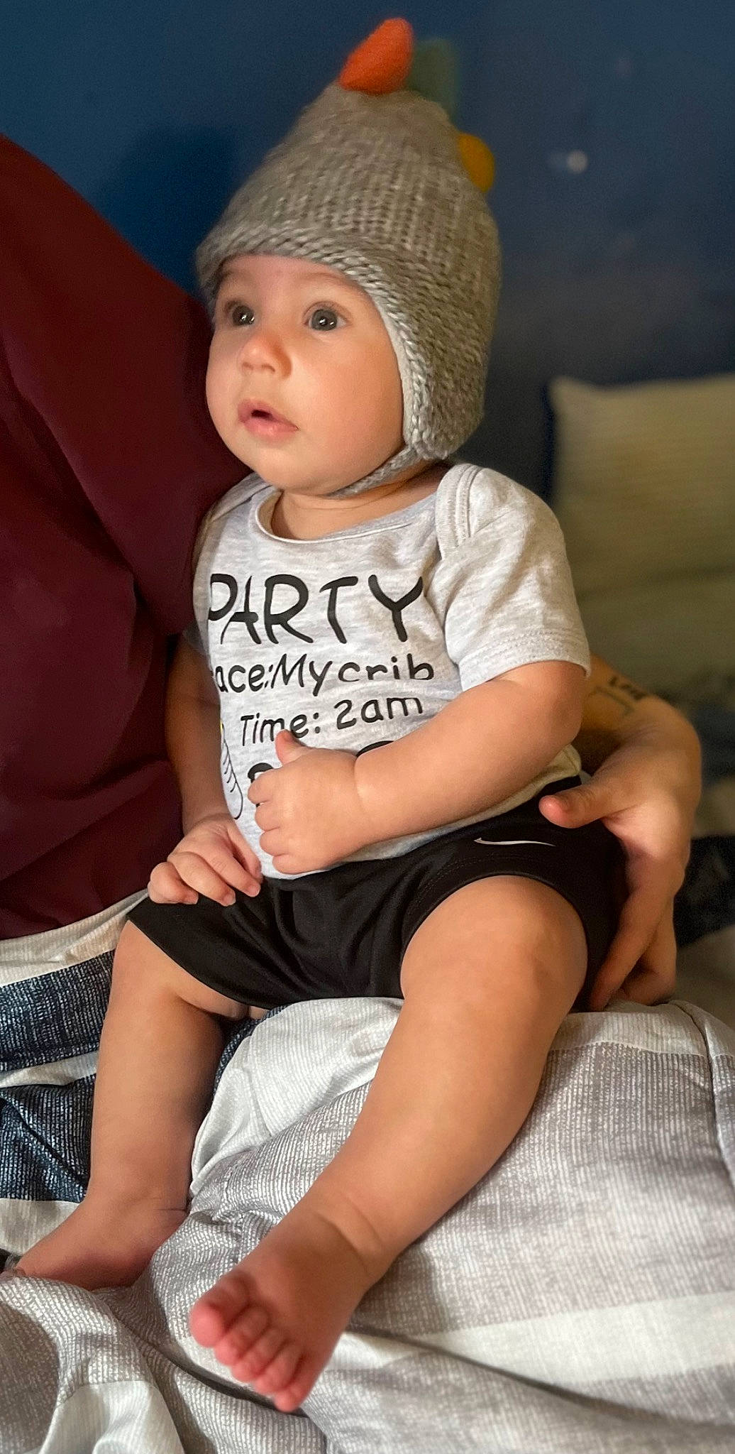 Anakin is registered to the contest to win money with this photo: baby, baby_toddler_clothing, cap, cheek, child, comfort, face, flash_photography, happy, headwear, human_leg, knee, leg, lip, person, sitting, skin, sleeve, smile, t_shirt