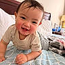 Kavien is registered to the contest to win money with this photo: baby, bed, bedroom, blanket, cheeks, child, clothing, crawling, face, furniture, happy, head, indoor, lamp, person, pillow, smiling, toddler, water_bottle, wood