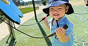 Kavien joined the competition — help win amazing prizes! baby, blue_clothing, bucket_hat, casual_wear, child, cute, daylight, fun, grass, happy, outdoor, person, play_equipment, playground, recreation, shoes, smiling, sunny, toddler, toy