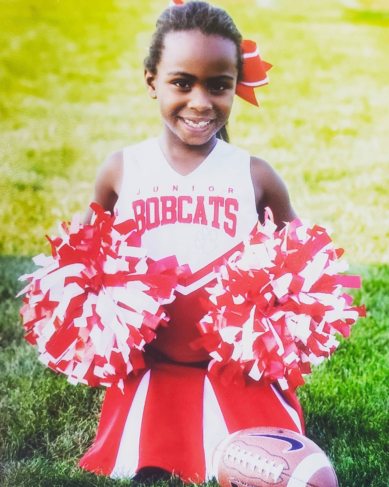 Kaliyah joined the competition — help win amazing prizes! cheerleading, child, costume, happy, joy, person, photo_shoot, photography, pink, pom_pom, ruffle, smile