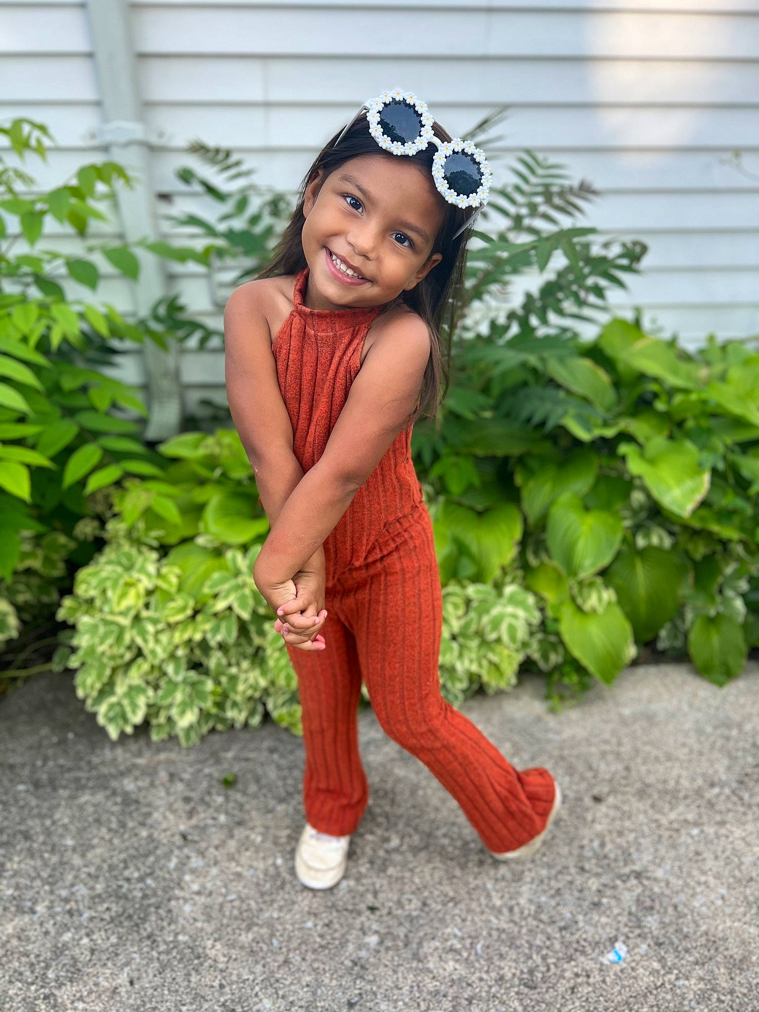 Laityn is registered to the contest to win money with this photo: baby_toddler_clothing, black_hair, child, face, flash_photography, goggles, grass, hair, happy, head, headwear, human_leg, jewellery, joy, outerwear, person, plant, portrait_photography, sitting, sleeve