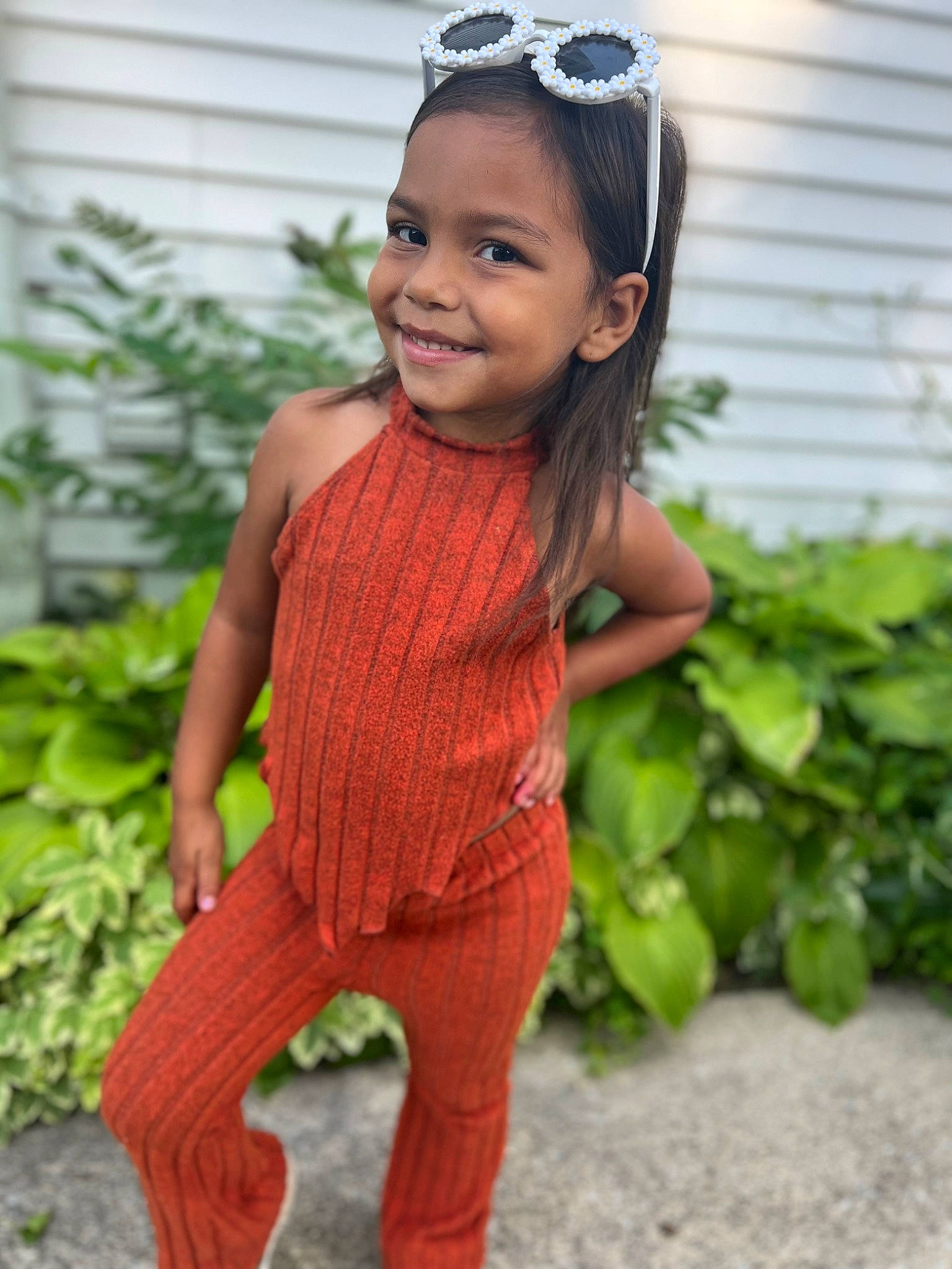 Laityn is registered to the contest to win money with this photo: baby_toddler_clothing, child, dress, face, fashion_accessory, grass, hairstyle, happy, head, headband, headpiece, jewellery, joy, lip, pattern, person, plant, sleeve, smile, sportswear