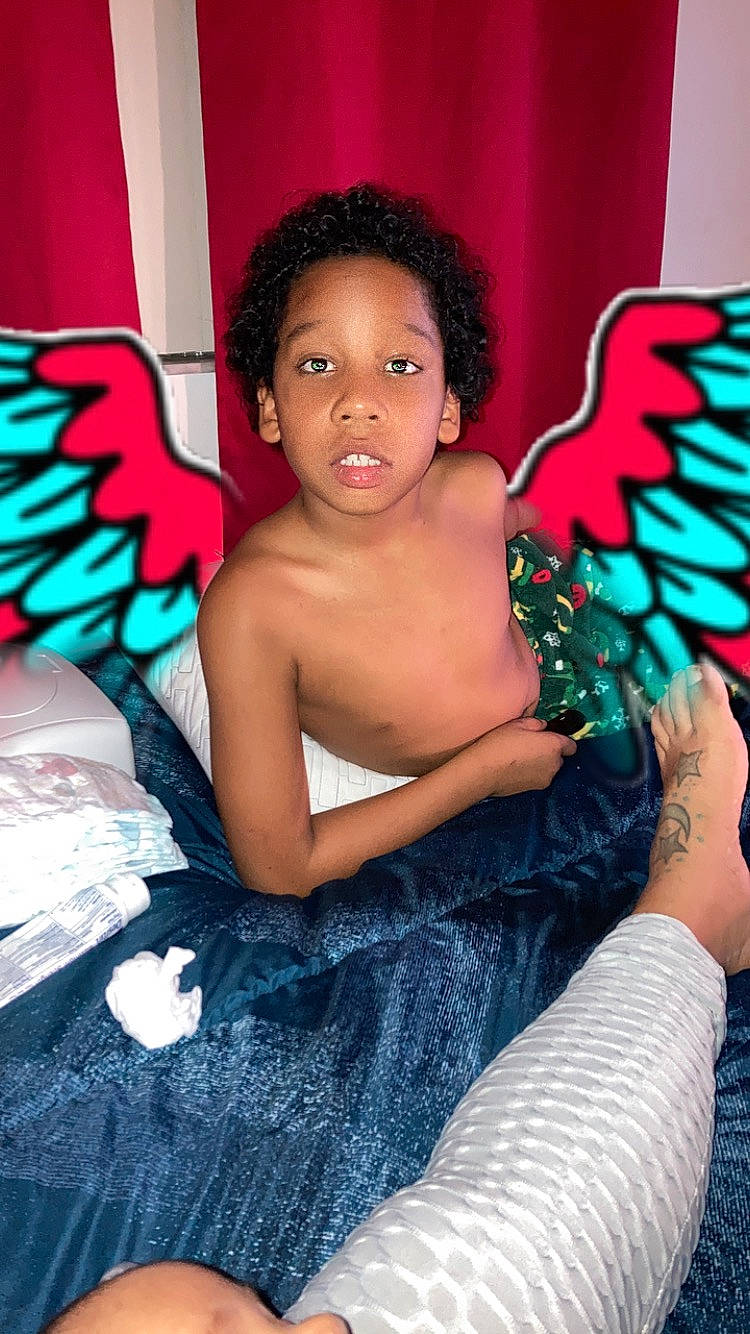 Alijah is registered to the contest to win money with this photo: arm, beauty, black_hair, chest, child, cool, event, eye, fashion, flash_photography, fun, hand, happy, head, human, human_leg, muscle, person, thigh, toddler
