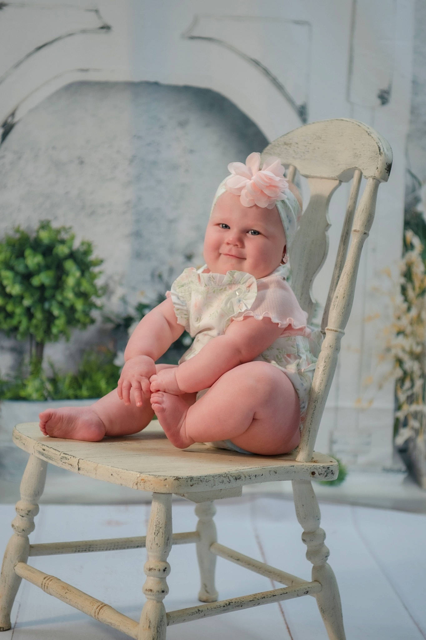 Saylor is registered to the contest to win money with this photo: baby, baby_products, baby_toddler_clothing, barefoot, chair, child, comfort, dress, foot, happy, hat, headwear, human_body, human_leg, leisure, peach, person, plant, sitting, smile