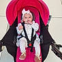 Emma a rejoint le concours — aidez-le/la à gagner de superbes lots ! baby, infant, stroller, pink, white_clothing, headband, pacifier, indoor, tile_floor, seated, straps, footwear, cute, child, person, young, looking_at_camera, hands, expression, soft_toys
