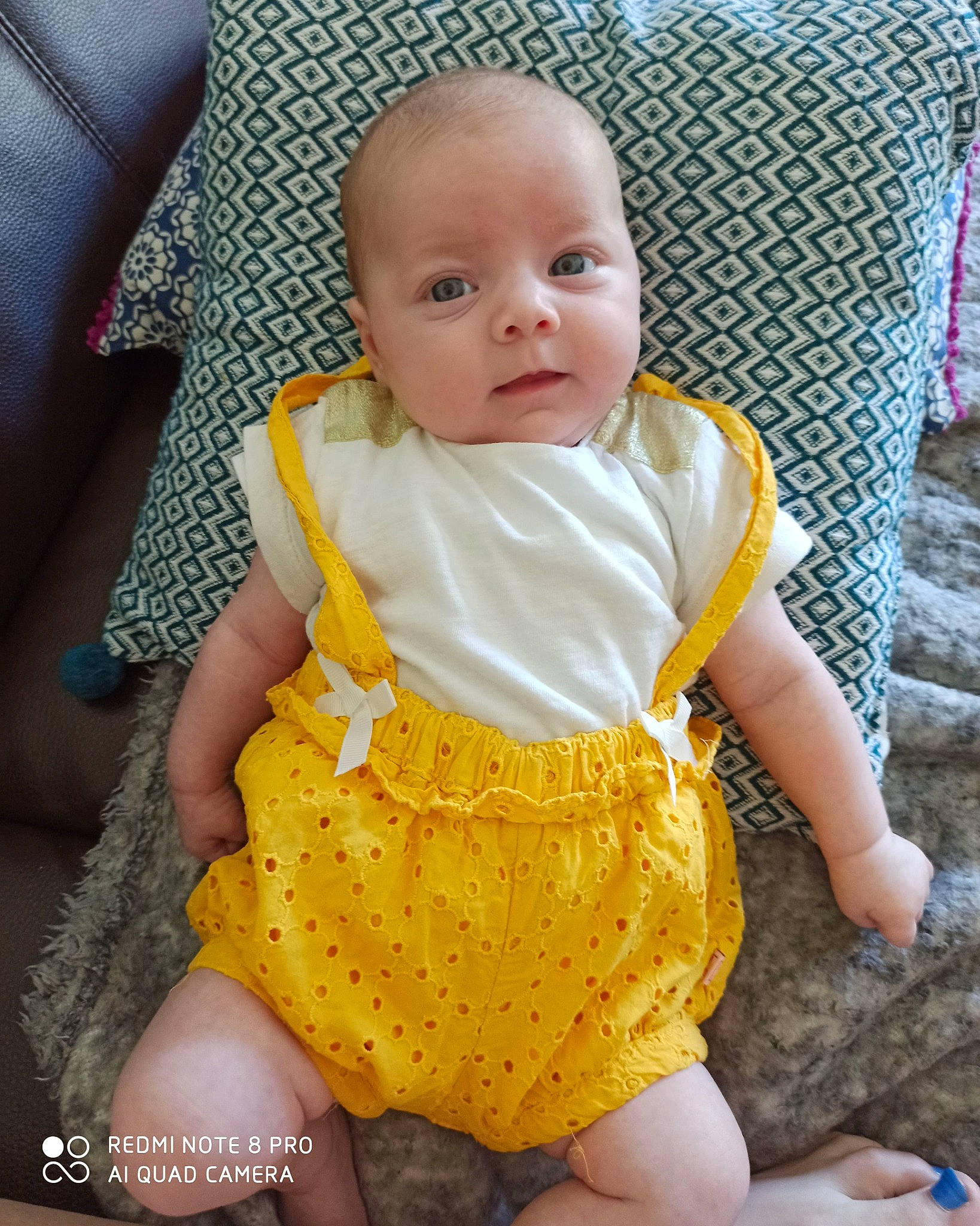 Lola participe au concours pour gagner de l'argent avec cette photo : baby, baby_toddler_clothing, chair, cheek, comfort, day_dress, dress, eye, face, happy, head, human_body, iris, neck, one_piece_garment, person, skin, sleeve, textile, thigh