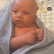Lorenzo joined the competition — help win amazing prizes! baby, towel, infant, wrapped, skin, newborn, face, hands, blanket, bed, mat, soft, indoor, person, child, cute, bath, resting, comfort, young