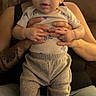 Alice joined the competition — help win amazing prizes! baby, child, adult, hands, bow_headband, tattoo, couch, clothing, pants, shirt, indoor, person, holding, seated, legs, face, expression, casual, home, warm_light
