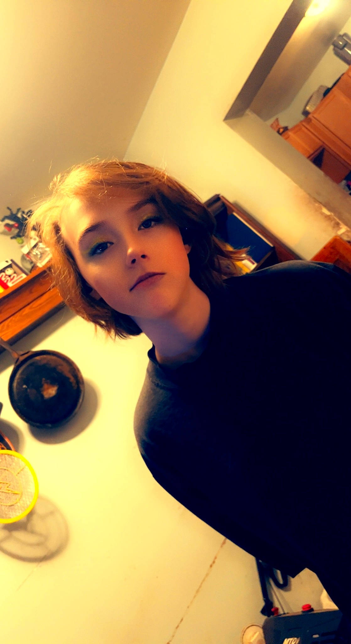 Chelsea joined the competition — help win amazing prizes! bangs, black_hair, brown_hair, chin, cup, drinkware, elbow, eyebrow, eyelash, eyewear, flash_photography, fun, happy, lip, long_hair, person, room, selfie, sitting, t_shirt