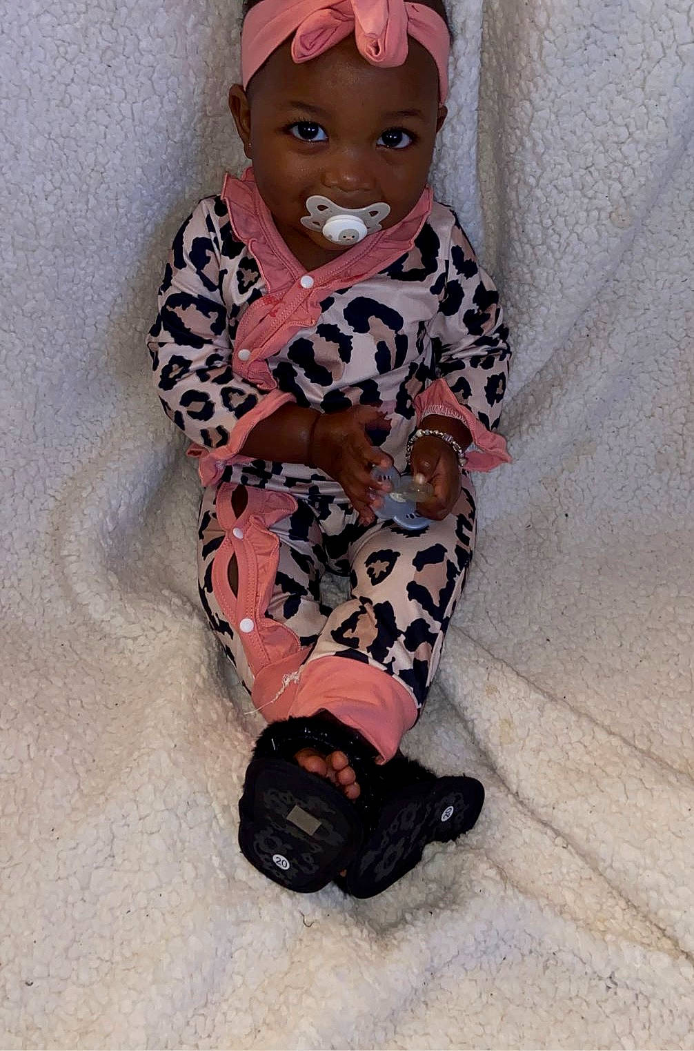 Journee is registered to the contest to win money with this photo: baby, baby_products, baby_toddler_clothing, carmine, child, costume, doll, fashion_accessory, flooring, head, knee, magenta, pattern, person, personal_protective_equipment, sitting, sleeve, smile, thigh, toddler