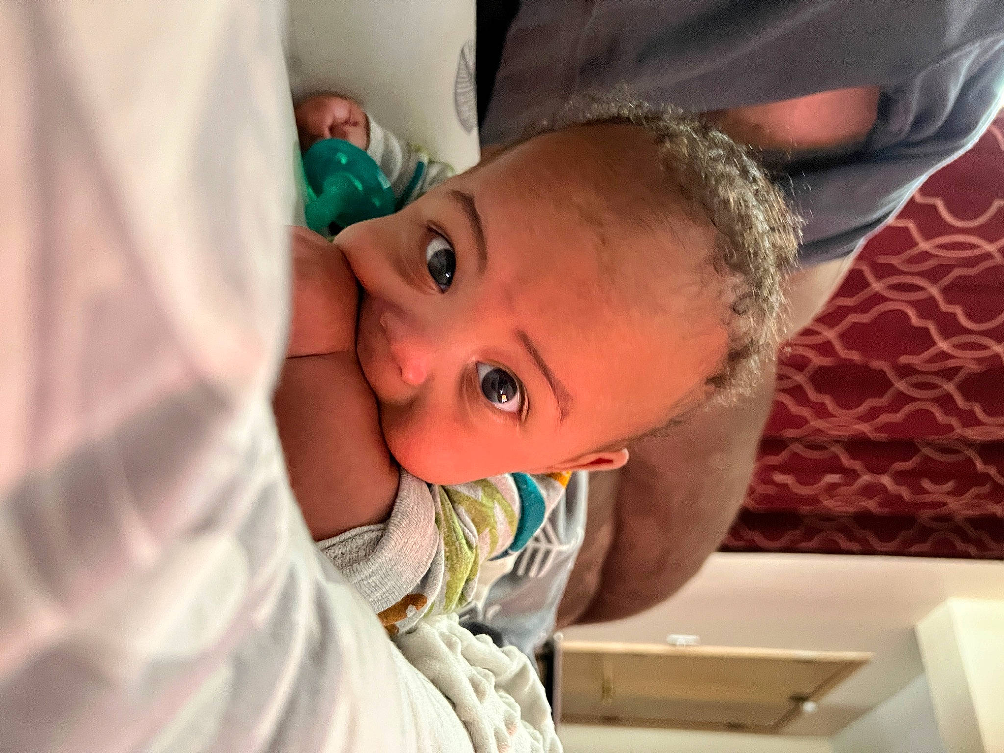 Chad is registered to the contest to win money with this photo: baby, baby_toddler_clothing, cheek, child, comfort, ear, eyebrow, eyelash, fun, happy, iris, lip, mouth, neck, nose, person, room, sitting, sleeve, smile