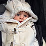 baby, child, coat, hood, fur_trim, stroller, face, eyes, cute, winter_clothing, outerwear, button, warm, portrait, closeup, infant, fashion, soft_texture, animal_ears, bundle