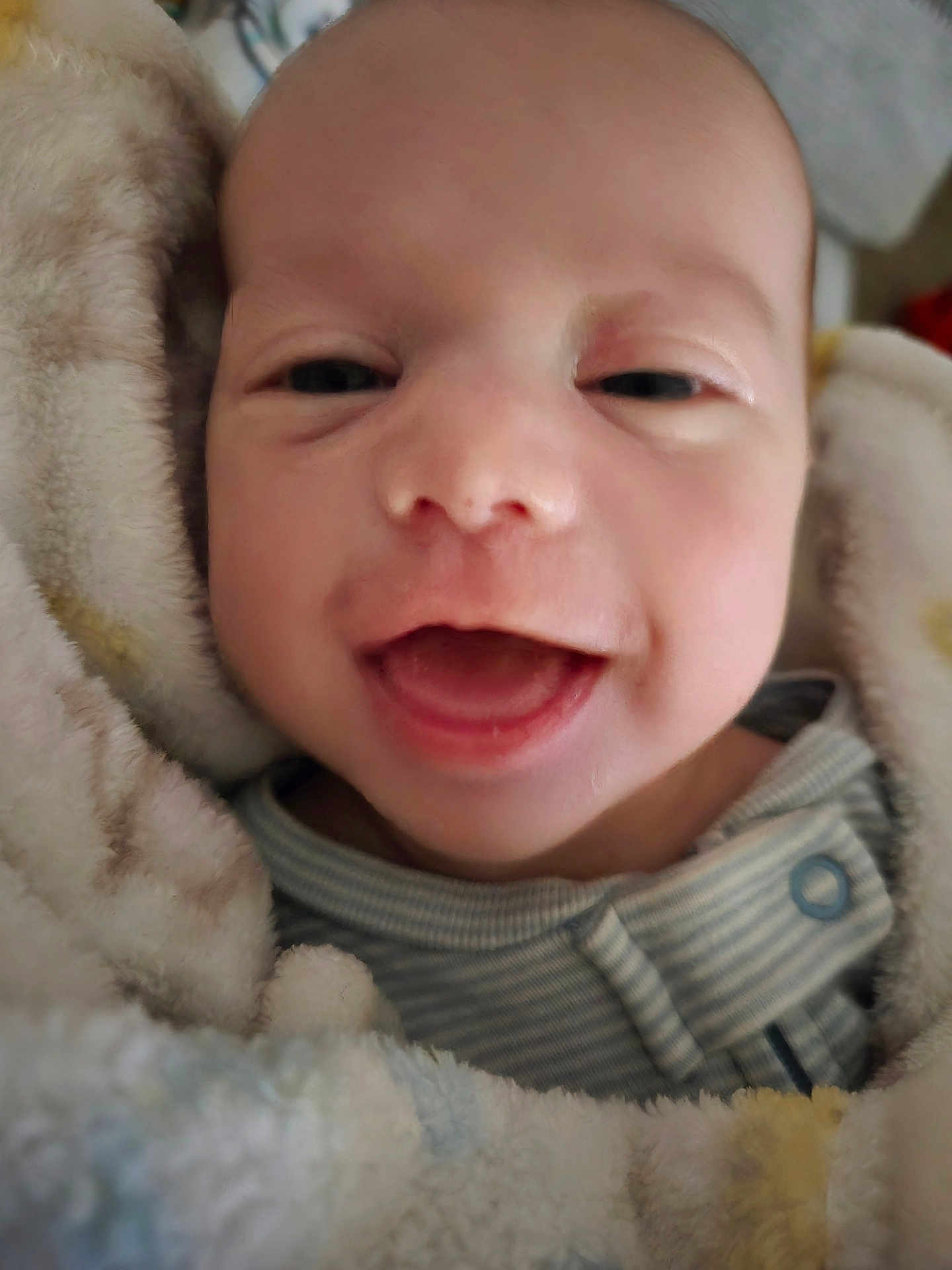 Toby joined the competition — help win amazing prizes! baby, smile, face, infant, blanket, soft, closeup, happy, child, wrapped, warm, clothing, cozy, newborn, portrait, cute, skin, head, expression, indoors