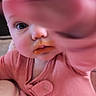Juniper is registered to the contest to win money with this photo: baby, child, close_up, curious, cute, expression, face, feeding_time, food, hand, high_chair, indoor, infant, messy_face, one_person, person, pink_clothing, portrait, skin, young_child