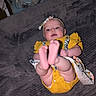 Juniper joined the competition — help win amazing prizes! baby, baby_gear, blanket, carpet, child, cozy, cute, family, feet, floor, headband, indoor, infant, lying_down, person, playful, soft_lighting, toddler, toy, yellow_outfit