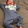 baby, newborn, infant, sleeping, blue_outfit, clothing, blanket, bed, feet, face, hands, relaxed, cute, child, portrait, indoors, soft, peaceful, resting, smile