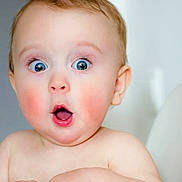 Khalil is registered to the contest to win money with this photo: adorable, baby, bare_shoulders, blue_eyes, child, closeup, cute, expression, face, head, human, indoor, infant, mouth_open, person, portrait, rosy_cheeks, skin, soft_light, surprised