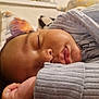 baby, sleeping, face, hand, cozy, gray_clothing, infant, peaceful, closeup, serene, indoor, soft_lighting, portrait, child, resting, young, skin, cute, toddler, sleep