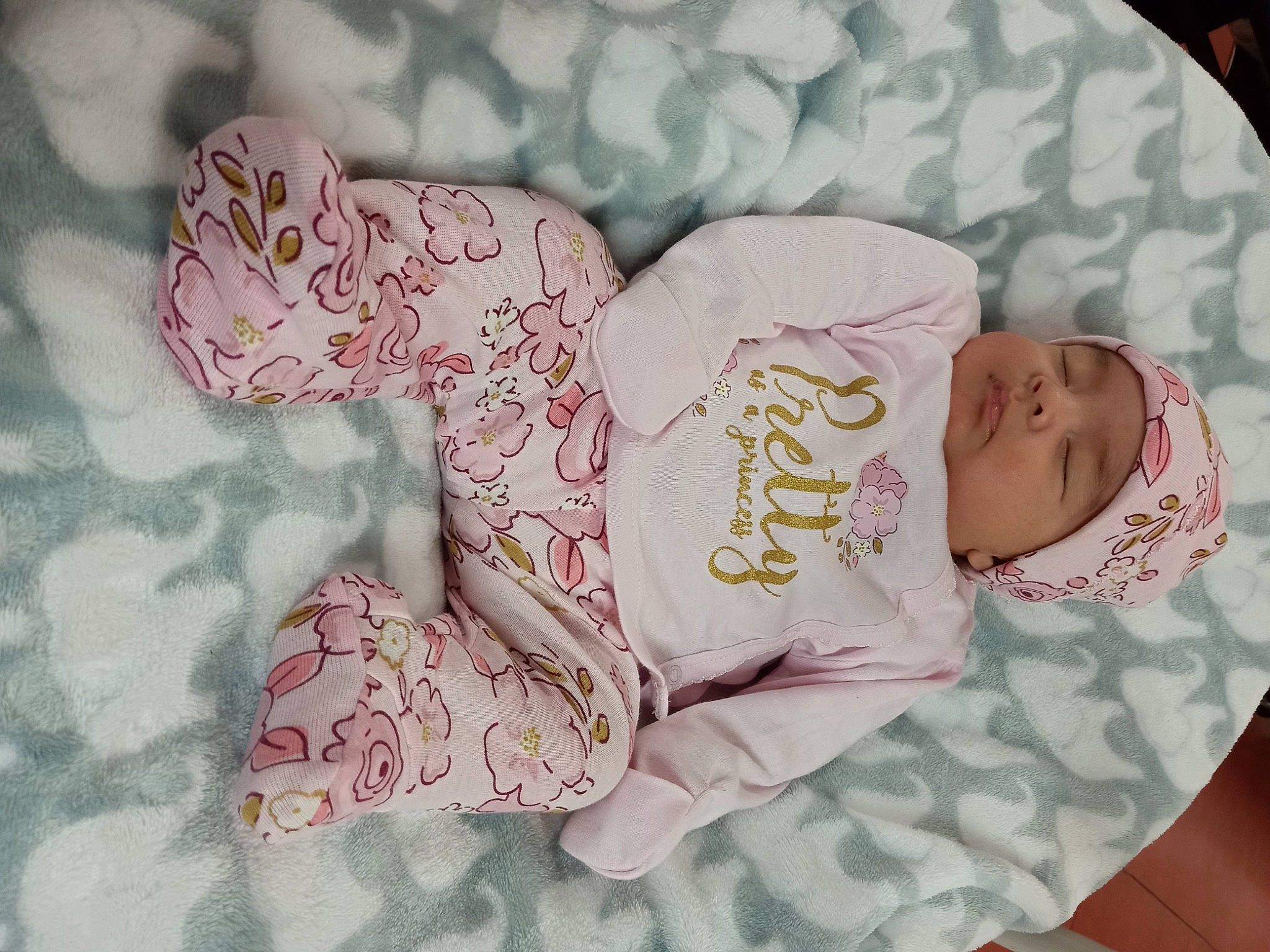 Hayley is registered to the contest to win money with this photo: baby, baby_products, baby_sleeping, baby_toddler_clothing, child, comfort, font, hat, headwear, linens, pattern, peach, person, pink, sleep, sleeve, toddler, visual_arts