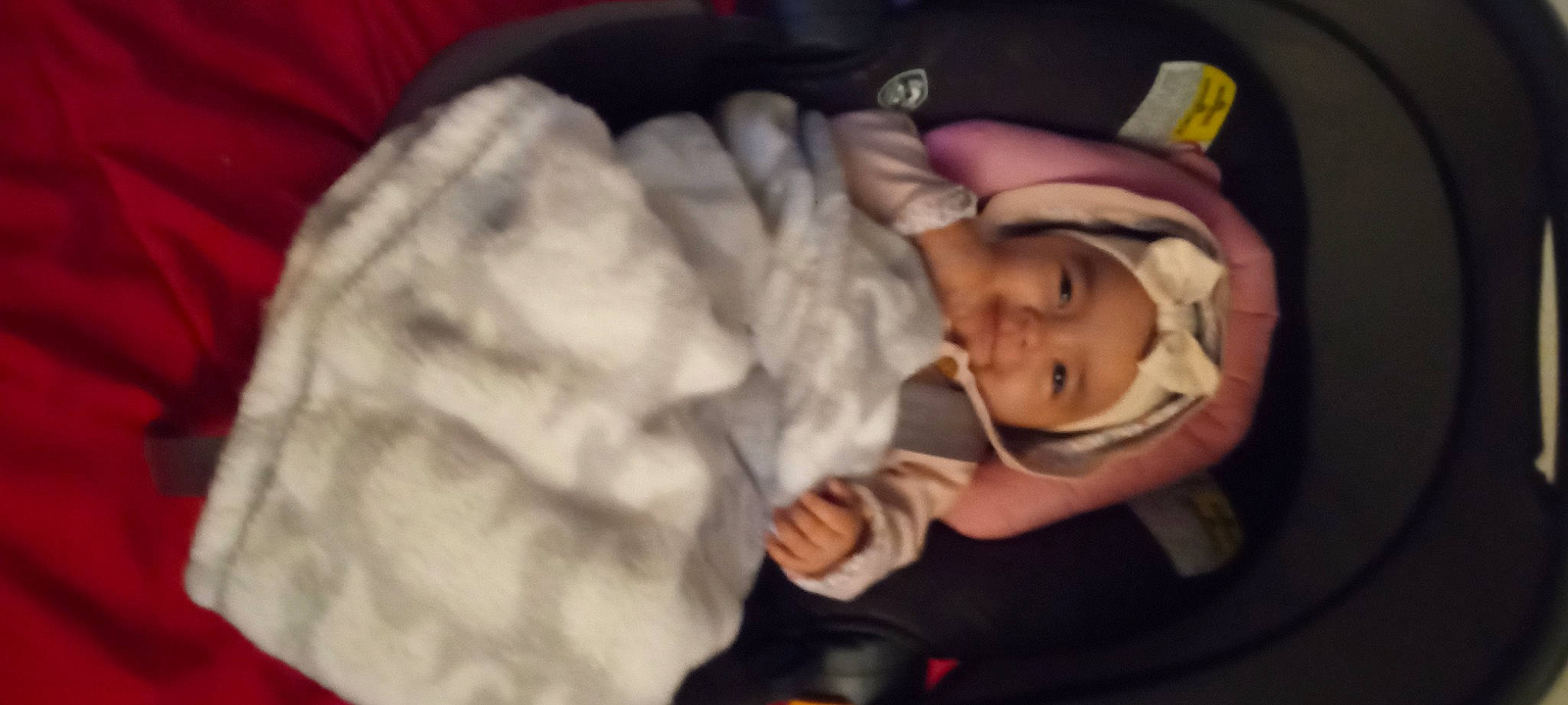 Hayley is registered to the contest to win money with this photo: baby, baby_carriage, baby_products, baby_safety, baby_toddler_clothing, cheek, child, comfort, fun, happy, hat, headwear, iris, linens, nose, person, sitting, sleeve, smile, thumb